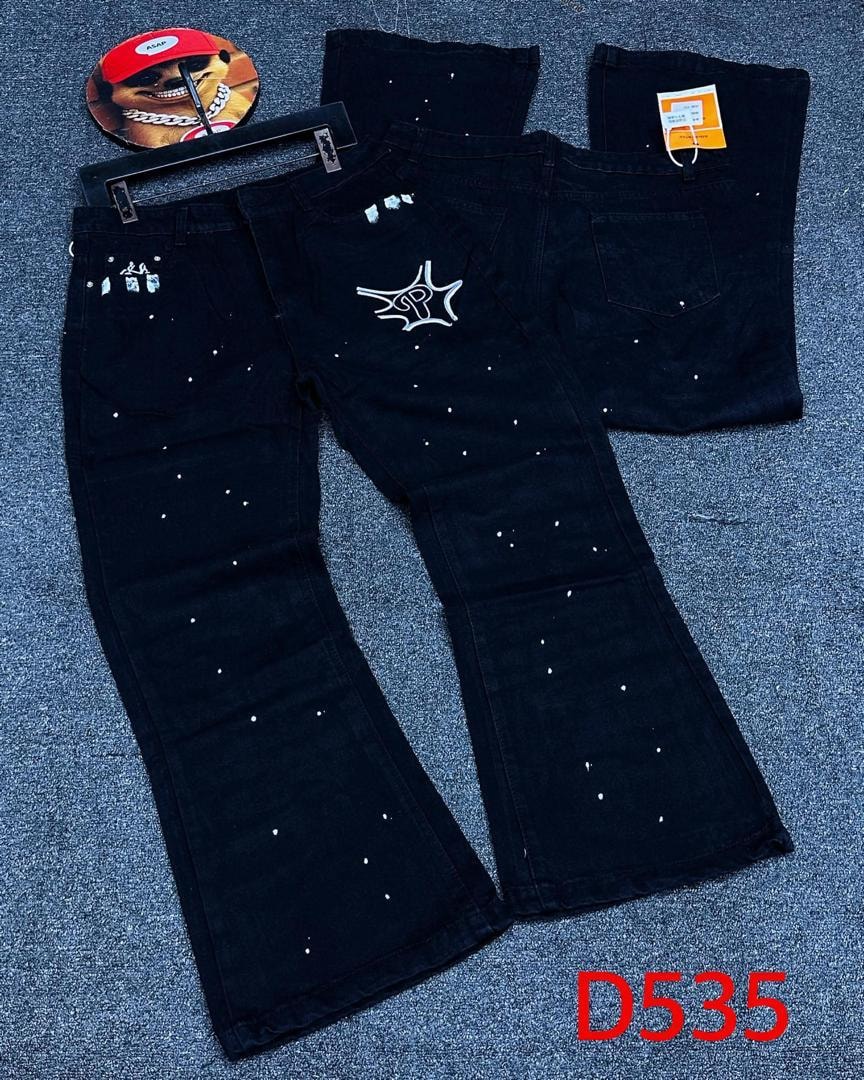 Black baggy jeans with white star prints and logo, shown with back view and accessories.
