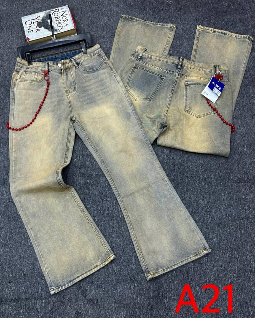Front, back and folded views of beige baggy jeans with red beaded chain and A21 tag.