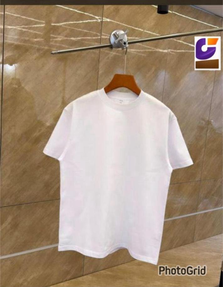 White plain unisex crew neck t-shirt on wooden hanger against tiled background.
