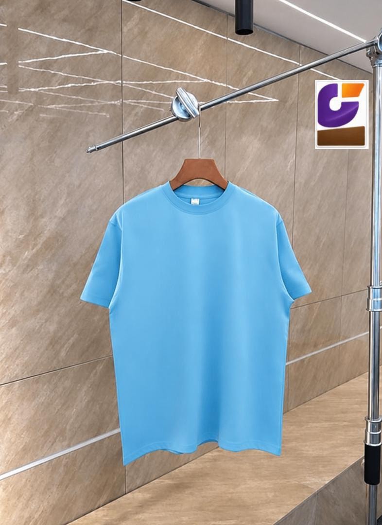 Light blue plain unisex crew neck t-shirt on wooden hanger against tiled background.