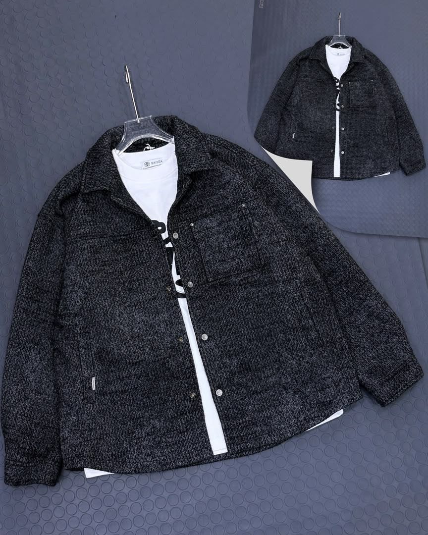 Black textured button-up shacket displayed on hanger over white t-shirt with inset back view.