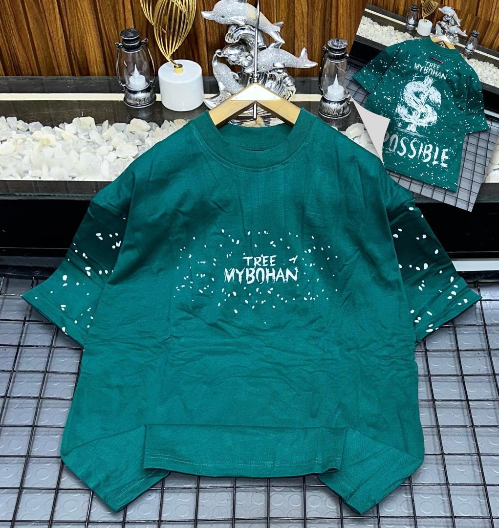 Green oversized t-shirt with white TREE MYBOHAN splatter print on front and back graphic inset.