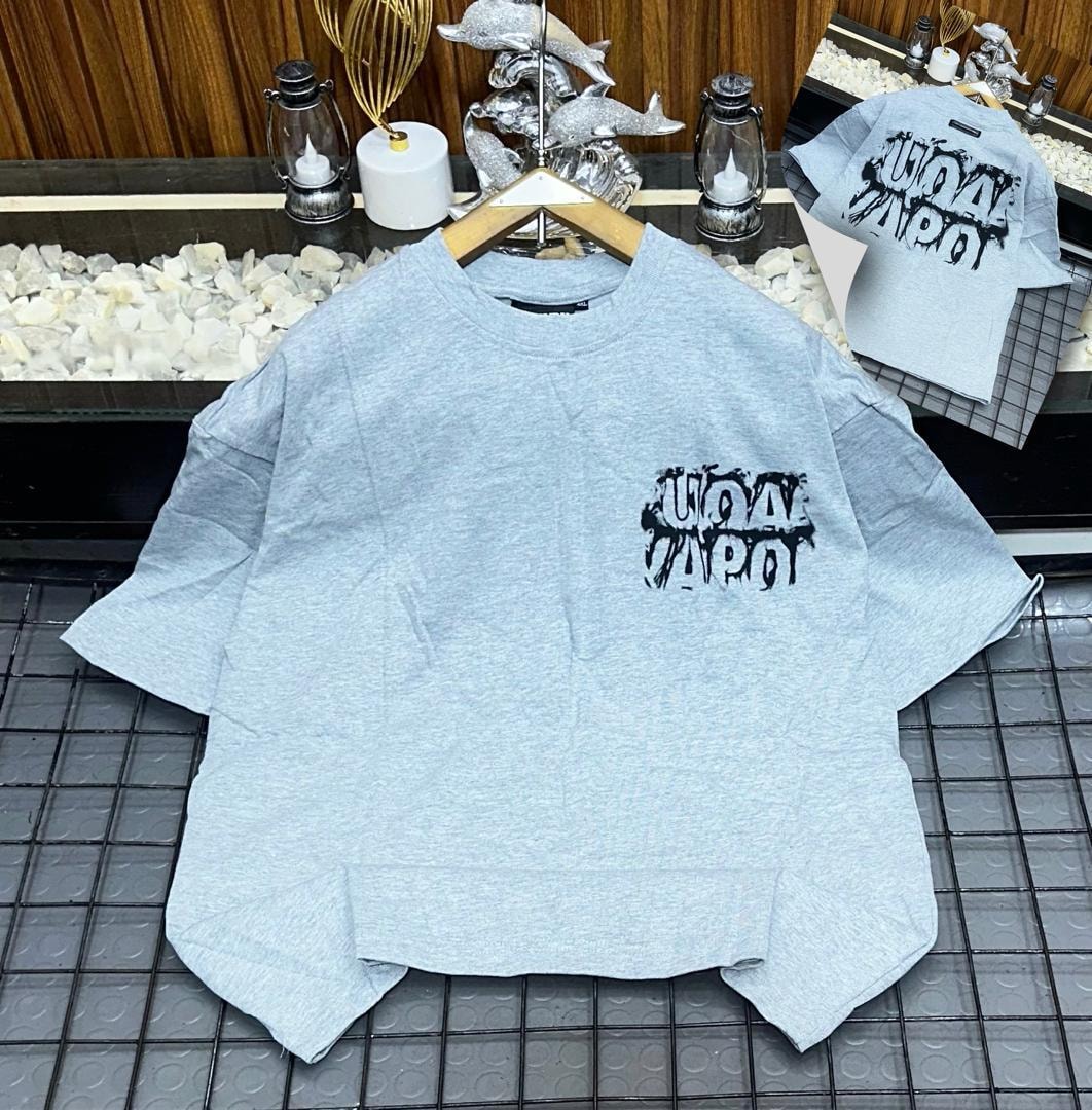 Gray oversized t-shirt with black dripping logo print on chest, shown on hanger with back inset.