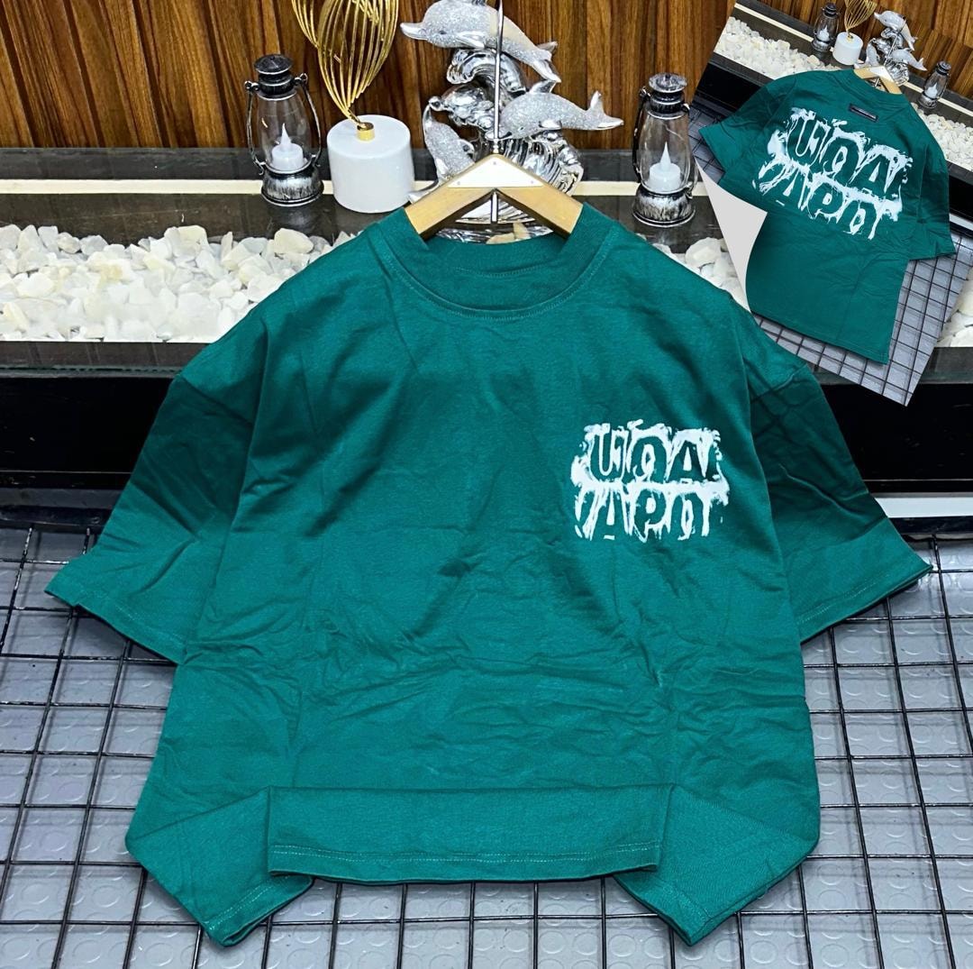 Green oversized t-shirt with white dripping logo print on chest, shown on hanger with back inset.