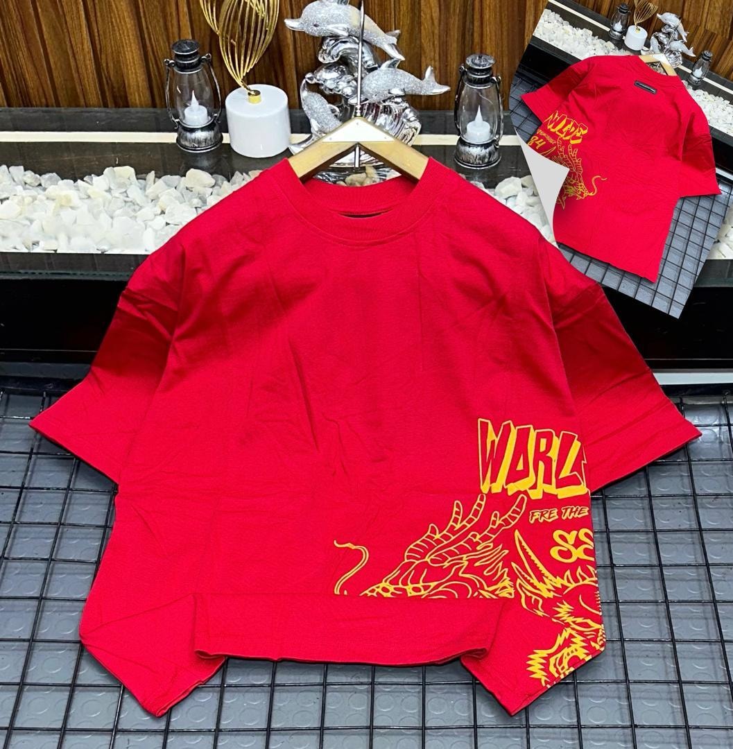 Red oversized t-shirt with yellow dragon and WARLZ graphic on front, shown on hanger with back inset.