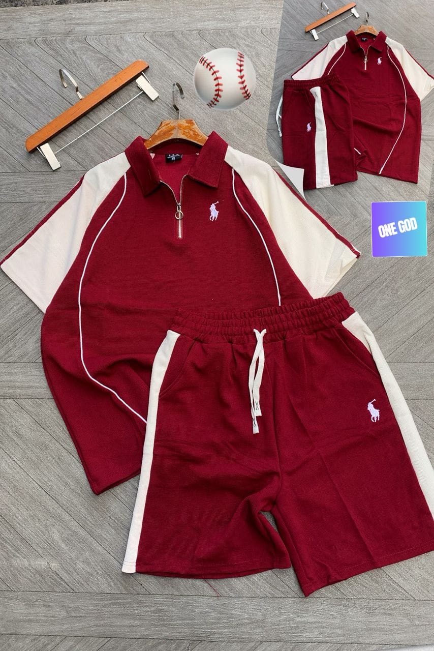 Burgundy polo two-piece set with white contrast sleeves and shorts displayed flat.