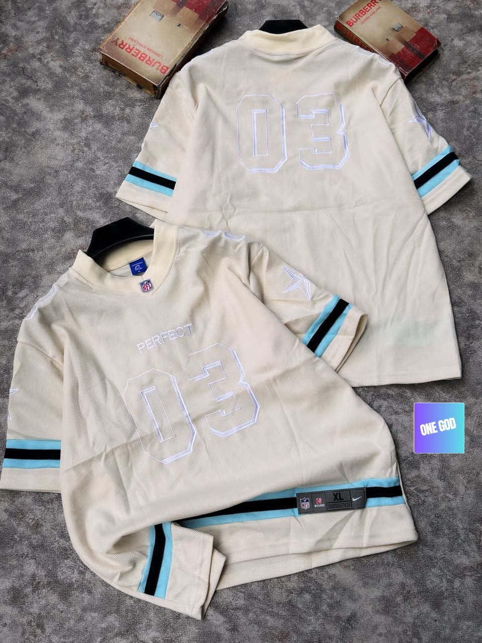 Cream mesh jersey with blue stripes, PERFECT and 03 graphics.