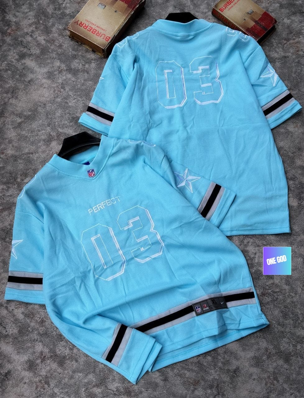 Light blue mesh jersey with PERFECT and 03 graphics.