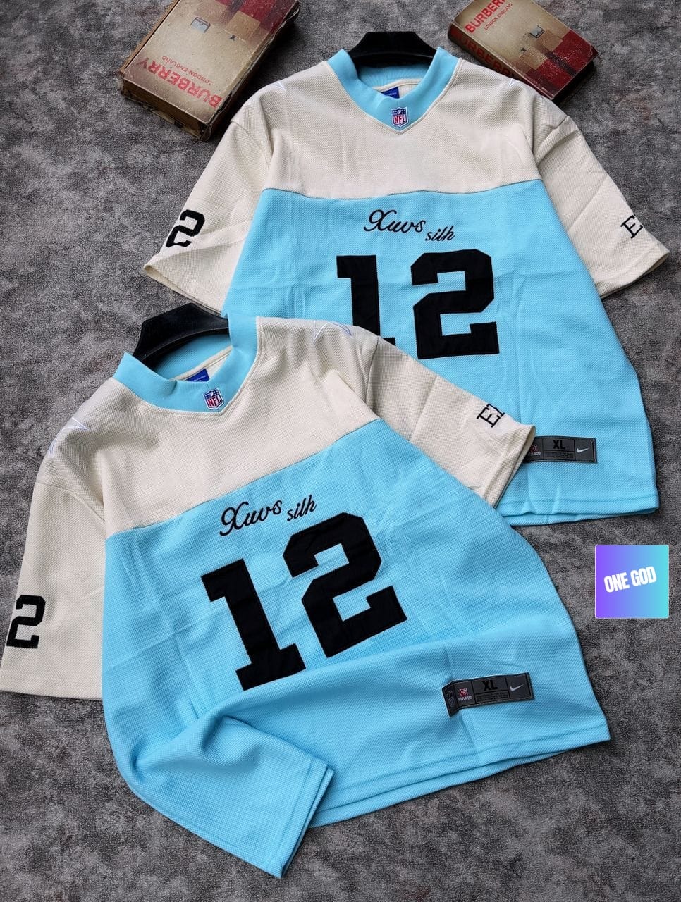 Light blue and cream two-tone mesh jersey with Xavs Silk 12 graphic on chest.