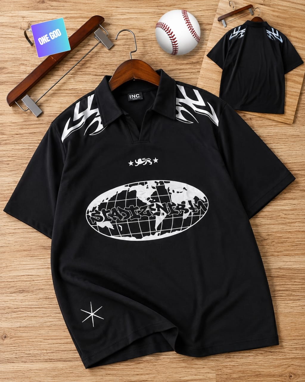 Black polo shirt with globe graffiti print, flame shoulder details and star accents.