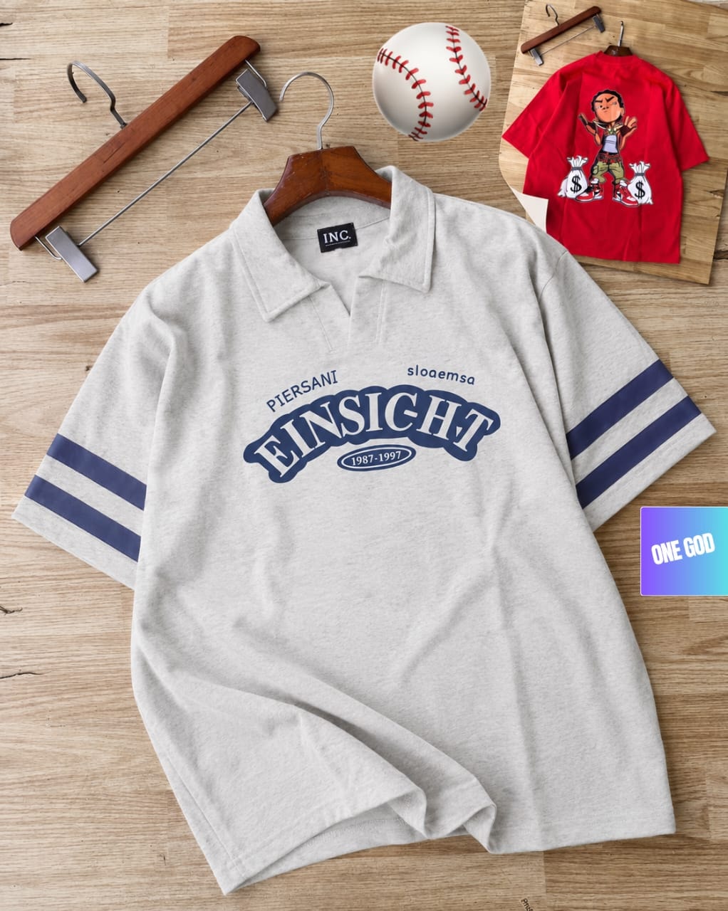 Light gray polo shirt with blue striped sleeves and large Einsicht text graphic on chest.