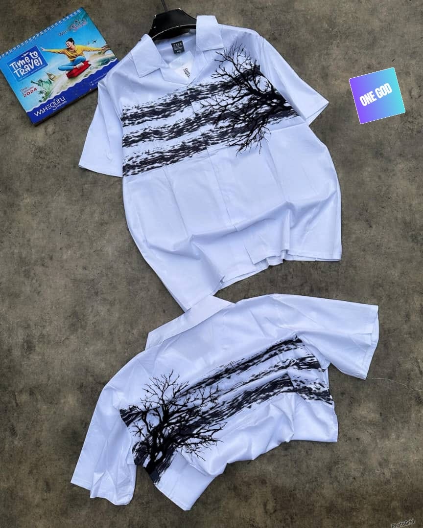 White short sleeve shirt with black tree and landscape horizontal print, shown in two views.
