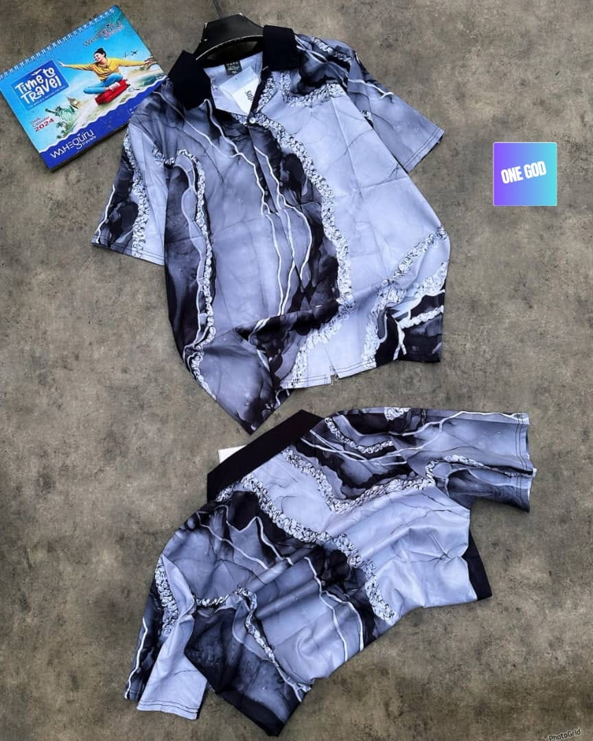 Grey and white marble patterned short sleeve shirt with decorative white lines.