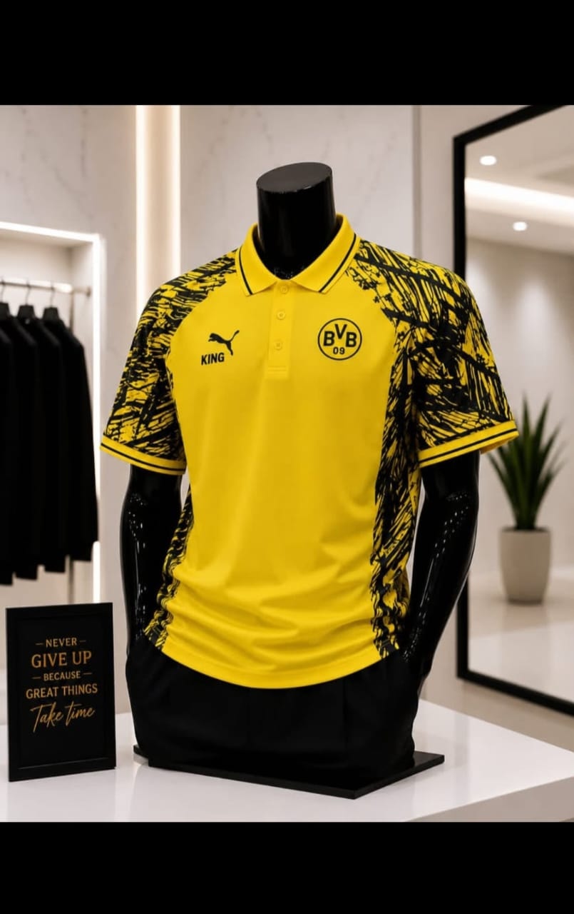 Yellow Borussia Dortmund polo jersey displayed on mannequin with black pants.