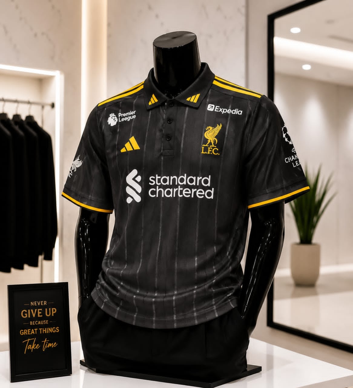 Black Adidas Liverpool football polo on mannequin.