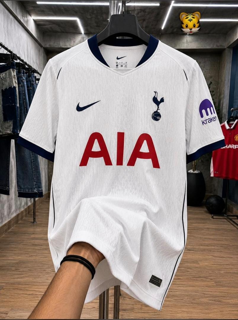 White Nike Tottenham Hotspur football jersey with red AIA logo on hanger.