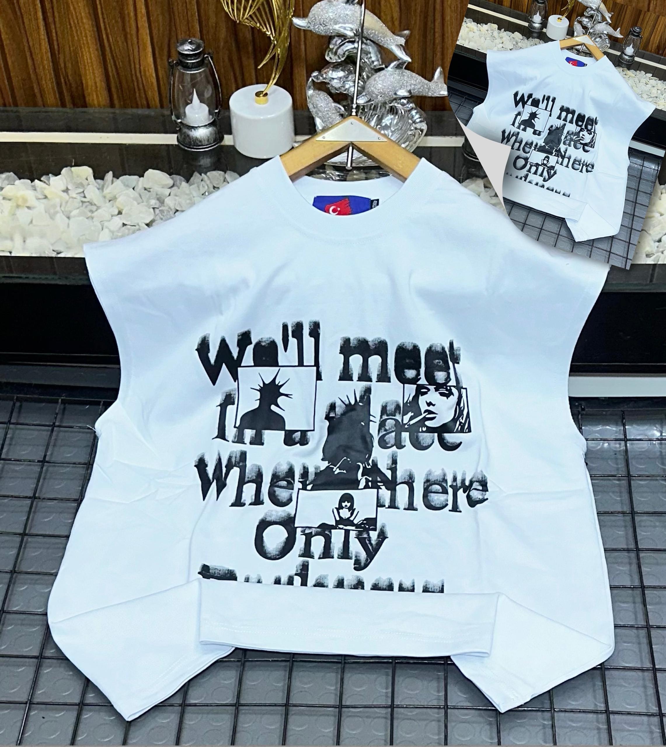 White armless graphic t-shirt laid flat showing front print.