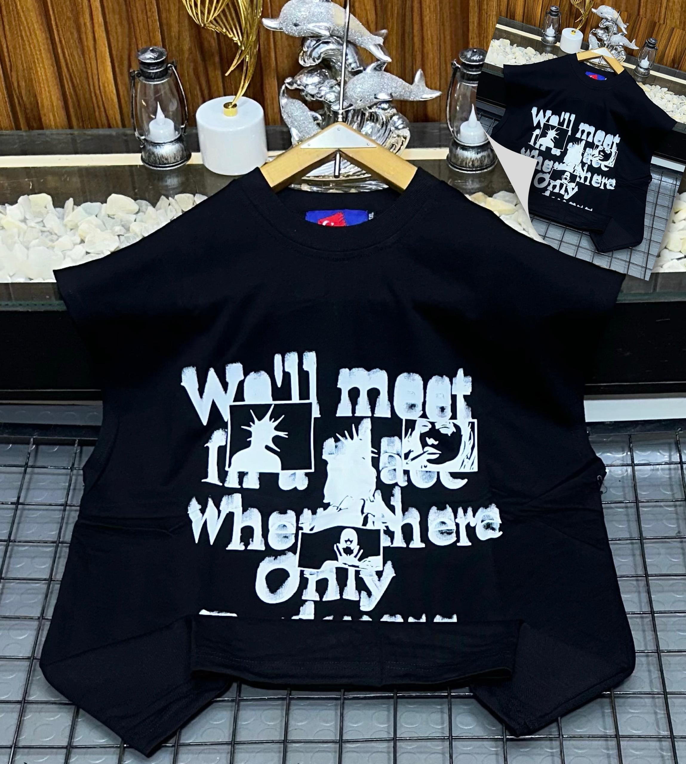 Black armless graphic t-shirt laid flat showing front print.
