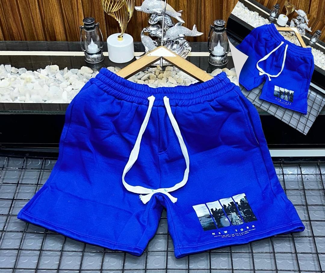 Blue unisex shorts with New York cityscape photo print.