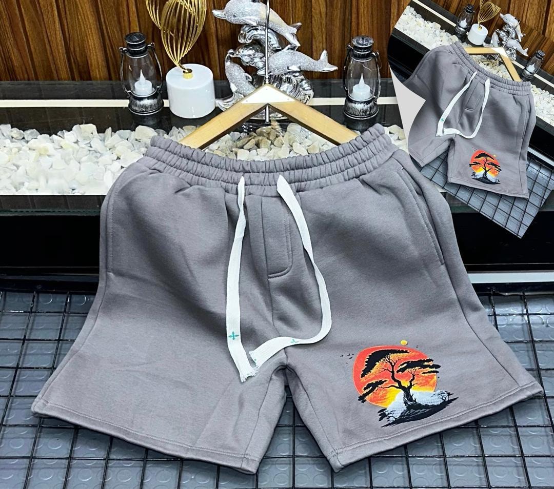 Gray unisex shorts with sunset tree graphic print.