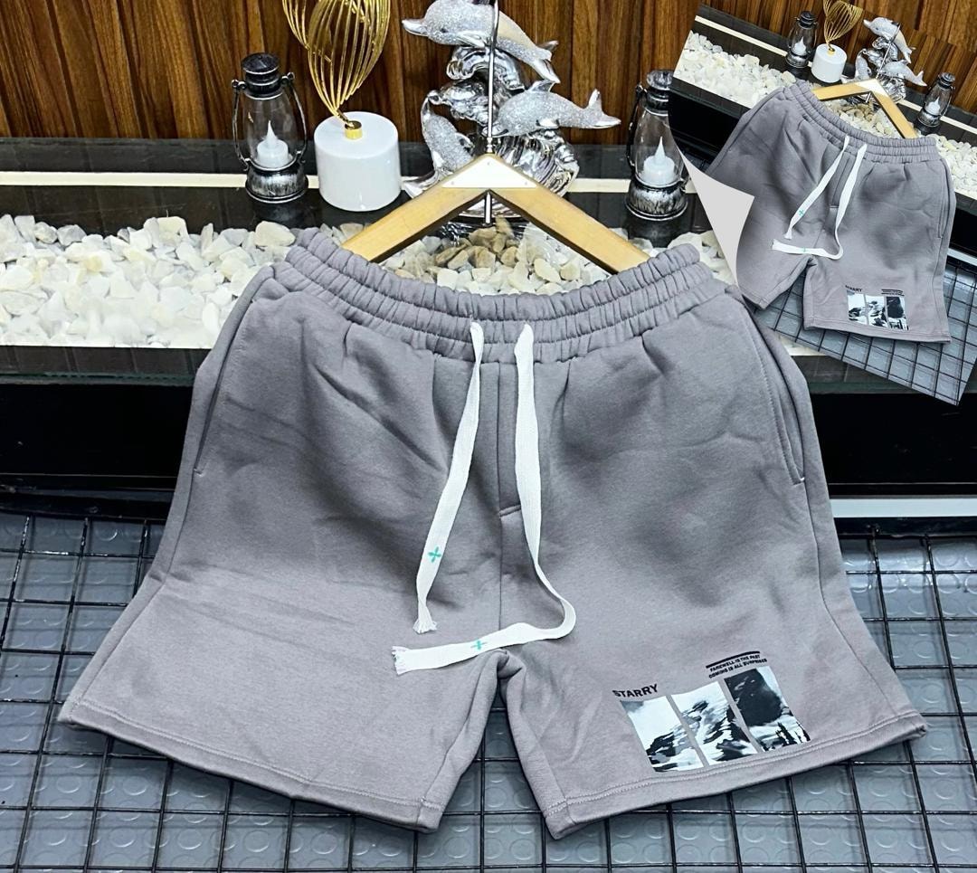 Gray unisex shorts with starry landscape photo print.