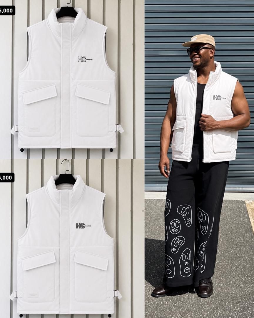 White HC Grazing puffer vest shown in flat lay and worn by male model