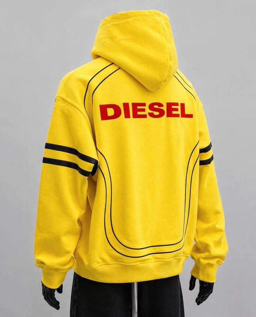 Back view of yellow Diesel hoodie with large red DIESEL print and black piping details.