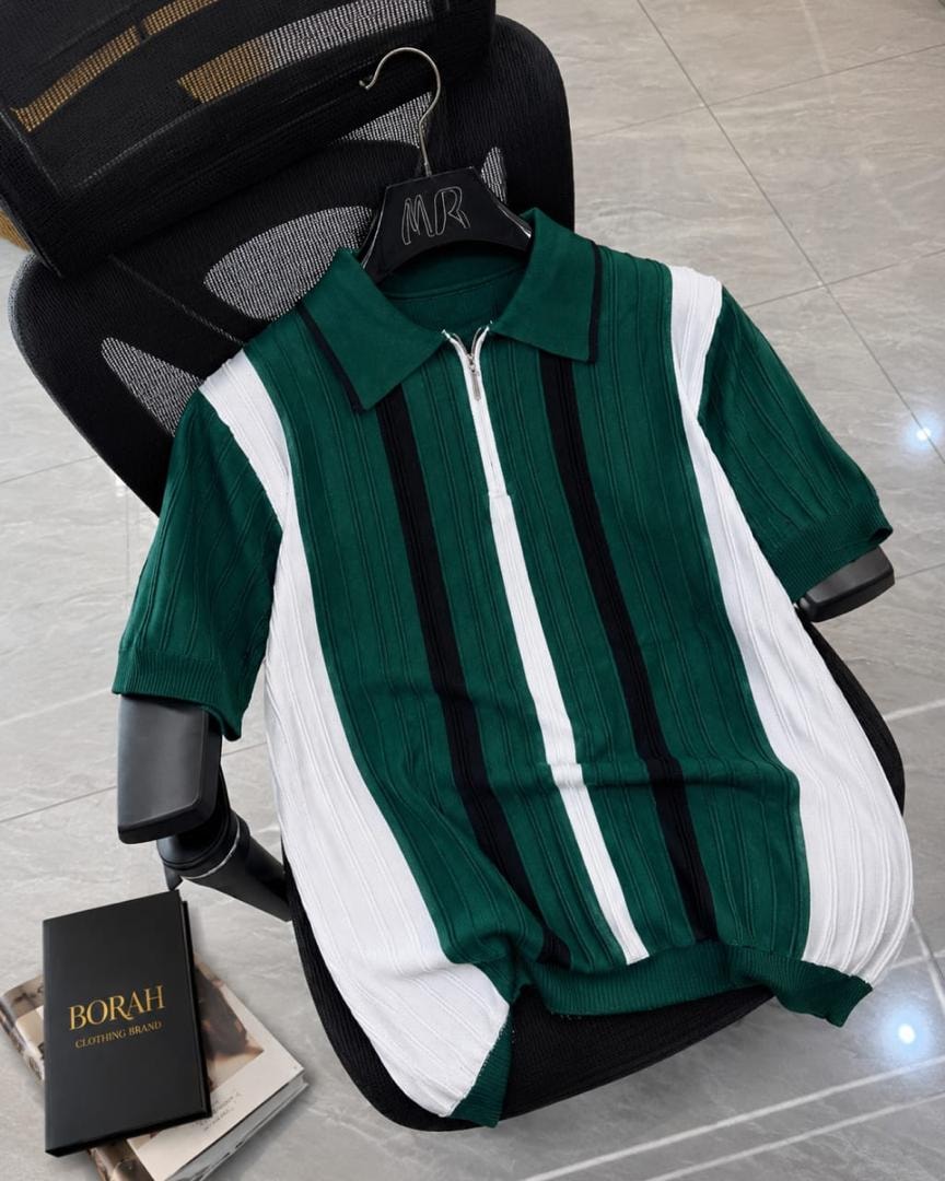 Borah green vertical striped quarter-zip polo shirt on black office chair beside brand box.