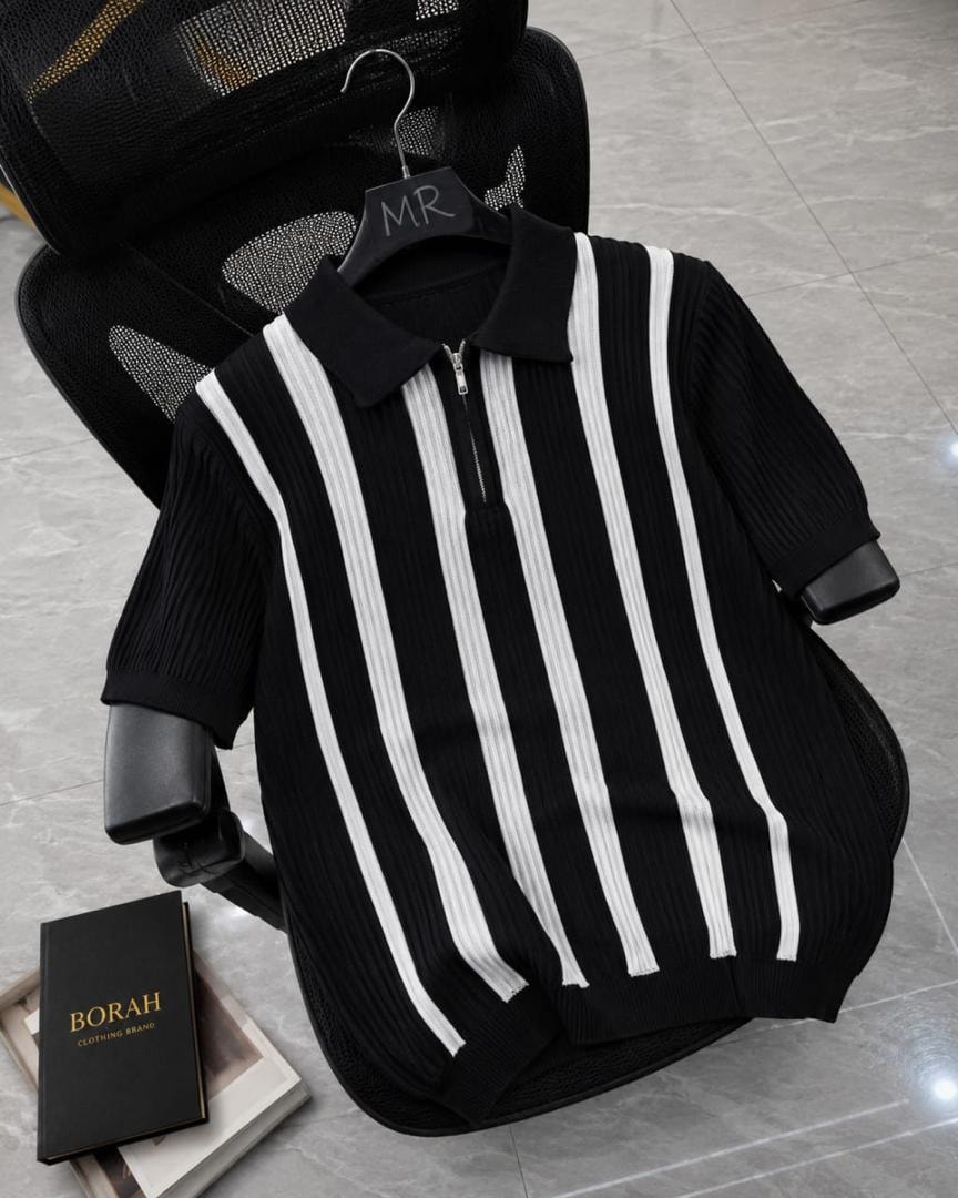 Borah black and white vertical striped quarter-zip polo shirt on black office chair beside brand box.
