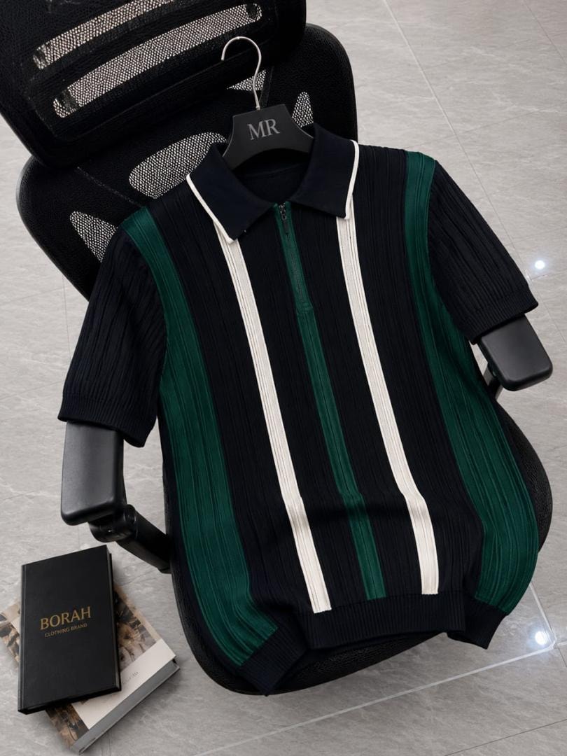 Borah black vertical striped quarter-zip polo shirt on black office chair beside brand box.