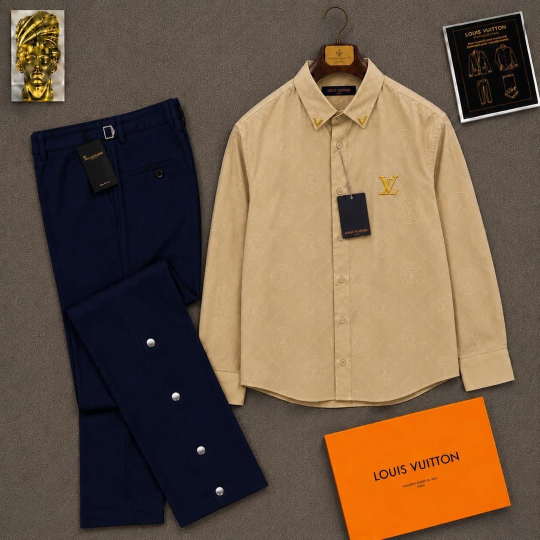 Beige long sleeve LV monogram shirt paired with navy trousers and orange LV box.