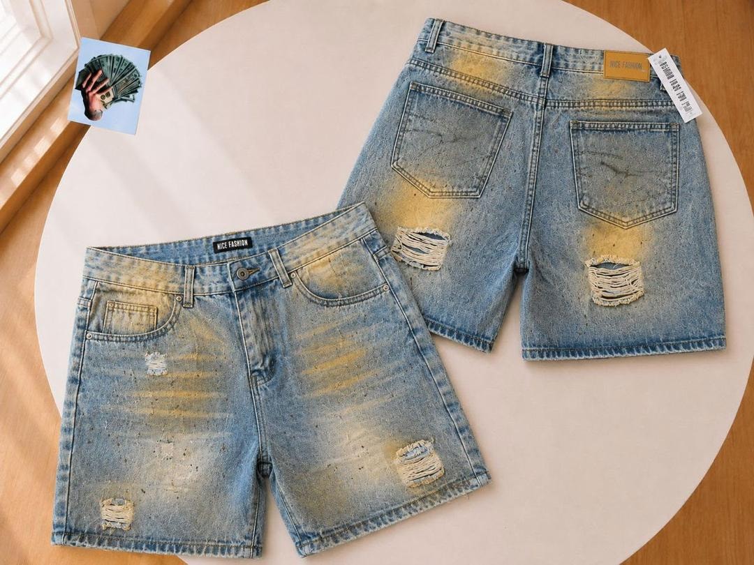 Front and back of light blue denim shorts with yellow bleach effects and rips.