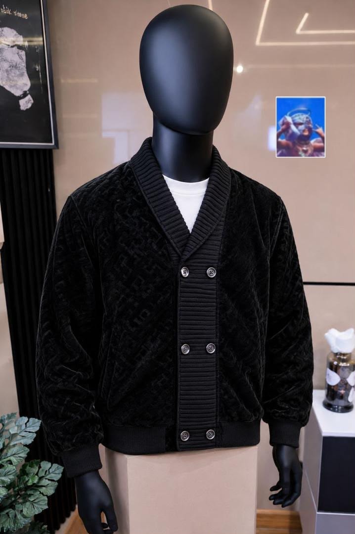 Mannequin wearing black monogram cardigan with button front and ribbed trims.