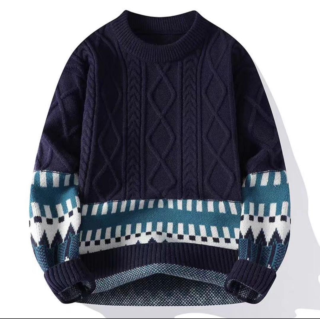 Navy blue cable knit sweatshirt with teal white and black geometric patterns on lower body and sleeves.