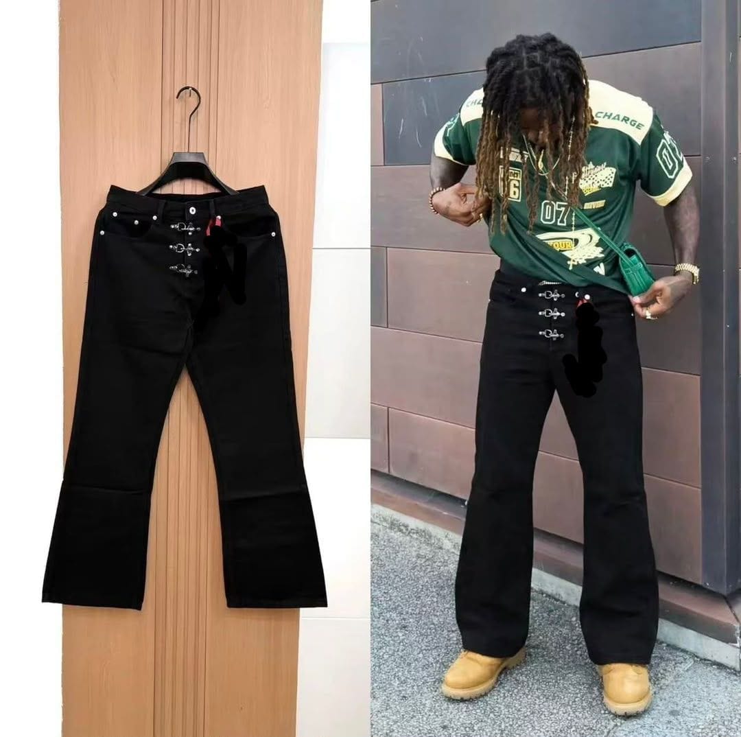 Split view of black baggy flared jeans with cross embellishments: flat lay on wooden door and model wearing them with green jersey top.