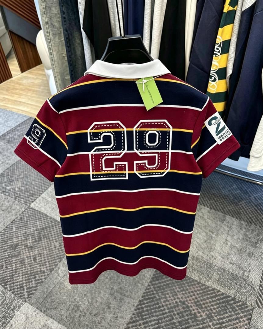 Back view of burgundy striped polo shirt showing large 29 embroidery.