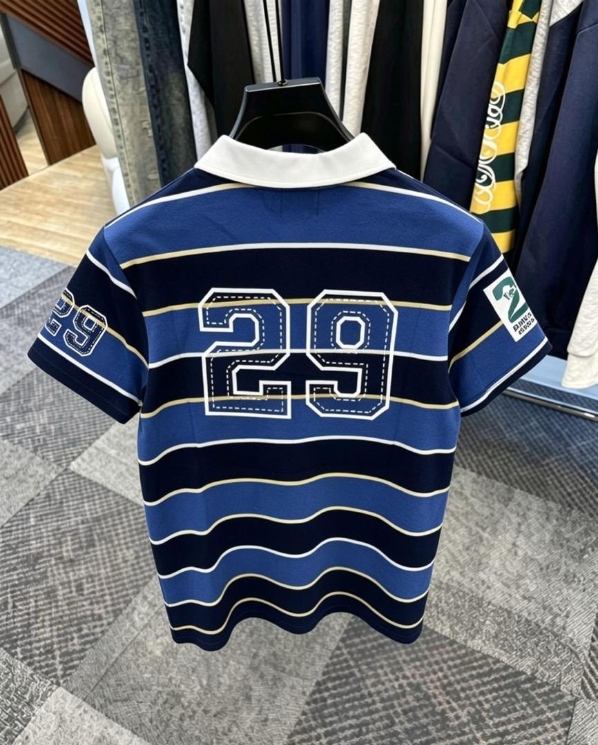 Back view of blue striped polo shirt showing large 29 embroidery.