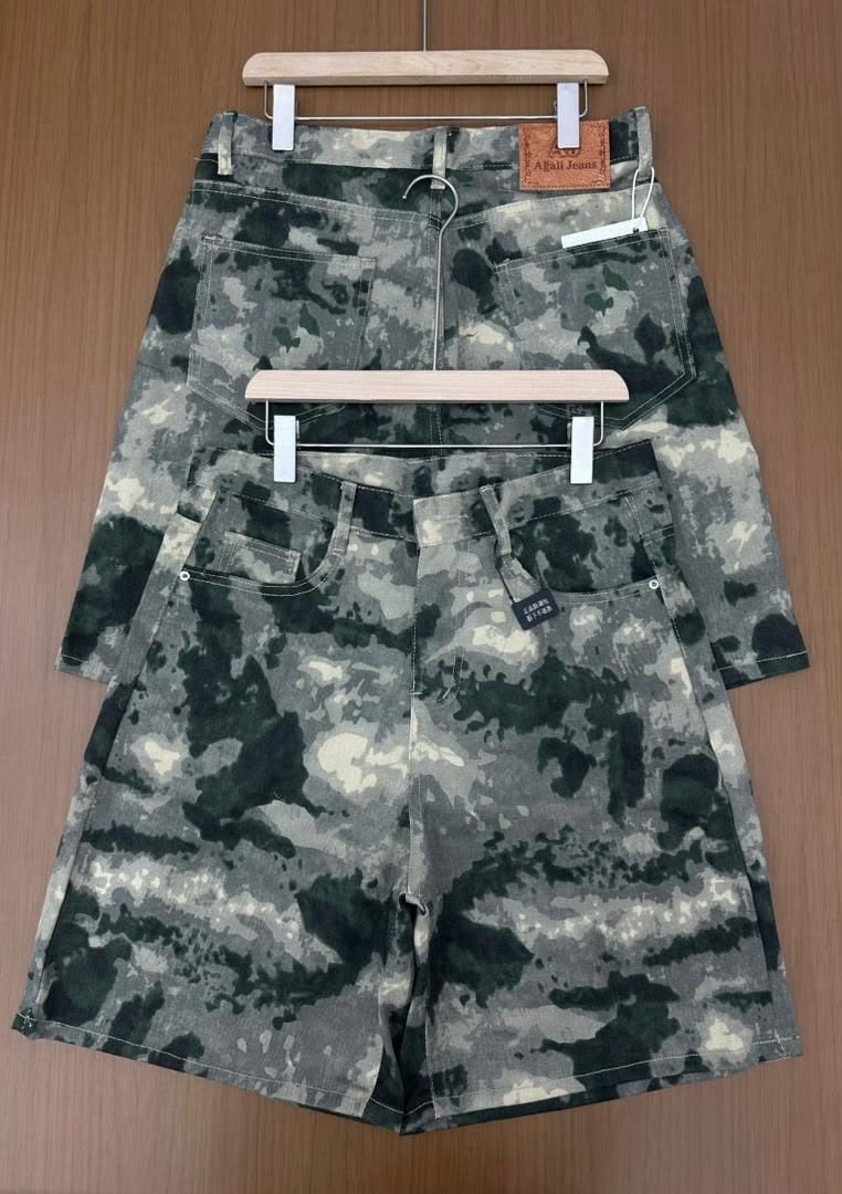 Front and back of camouflage jorts with visible Afgani Jeans leather patch and tags.