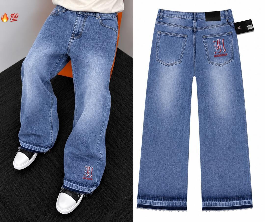 Person wearing blue Hoodrich embroidered baggy jeans and back view with logo.