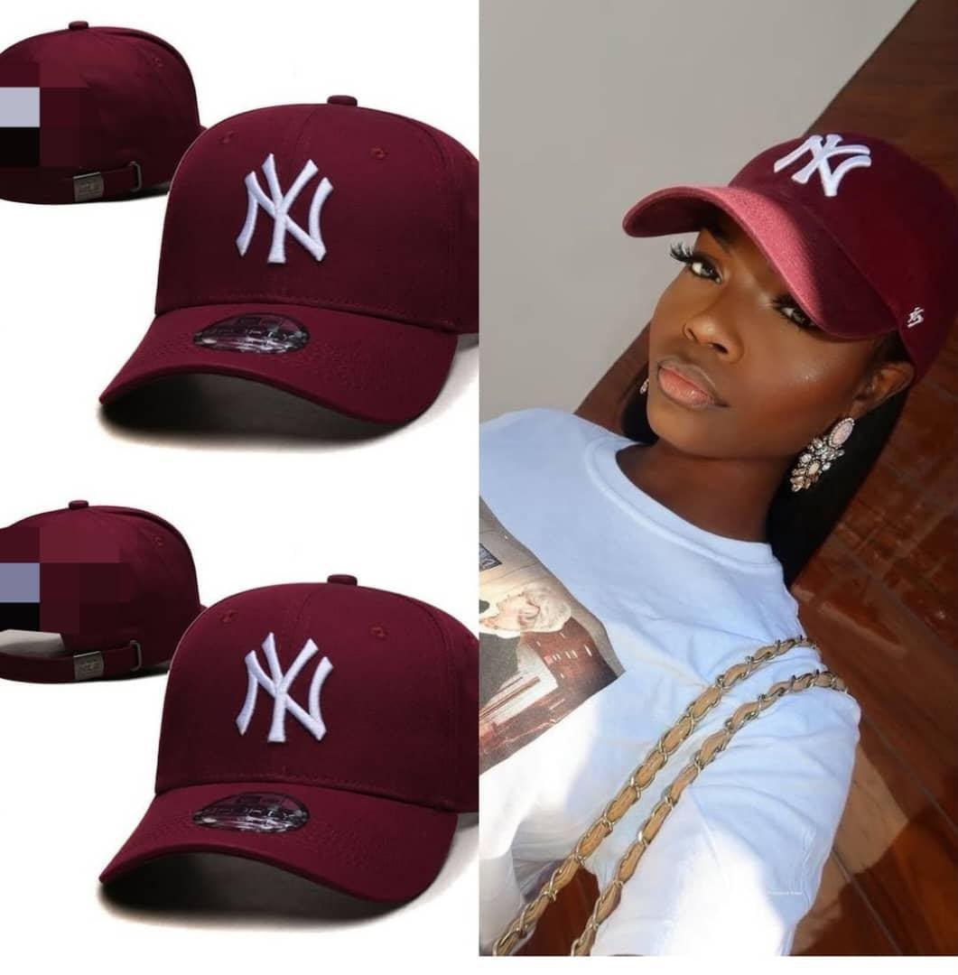 Multiple views of burgundy baseball cap with white NY logo, including woman wearing it.