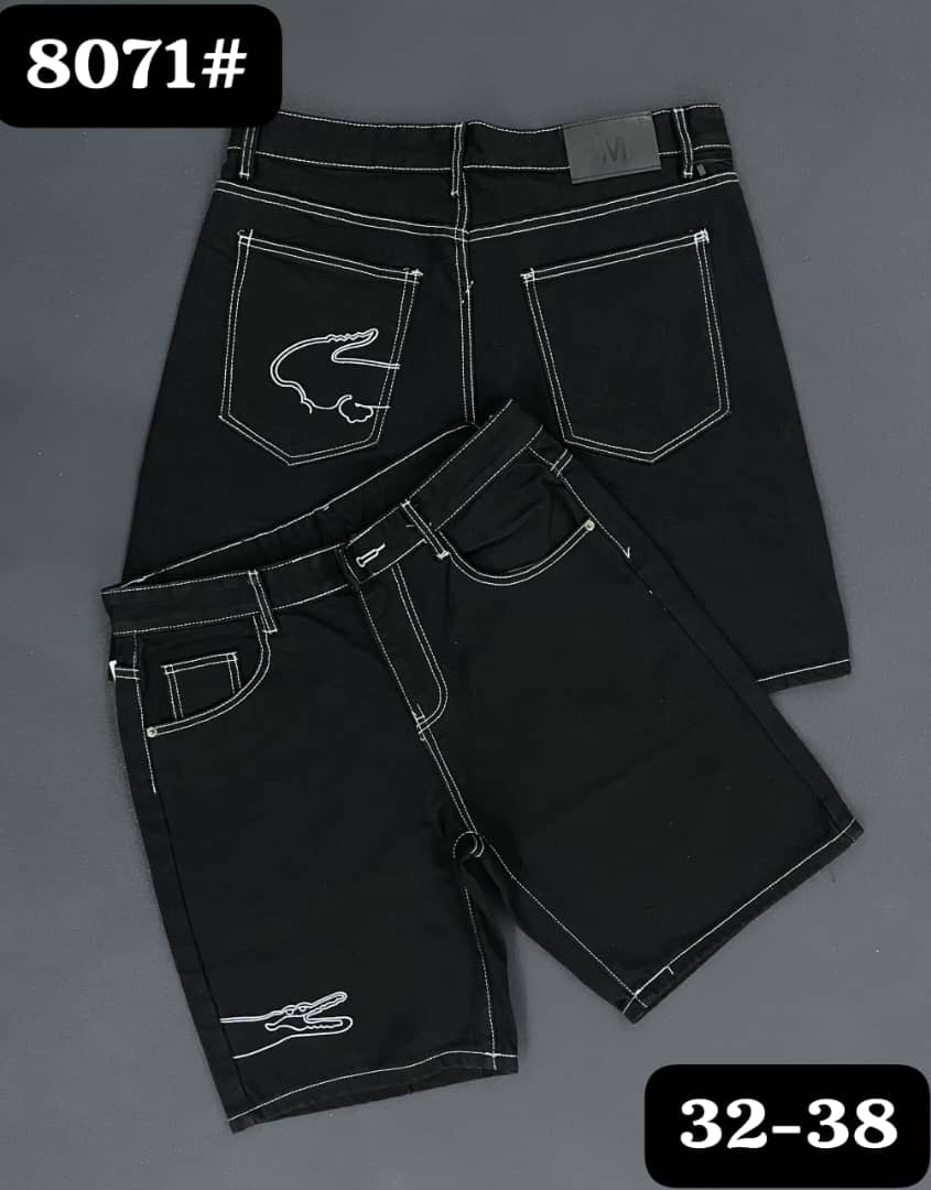 Black denim shorts with white contrast stitching and crocodile logos on front and back pockets.