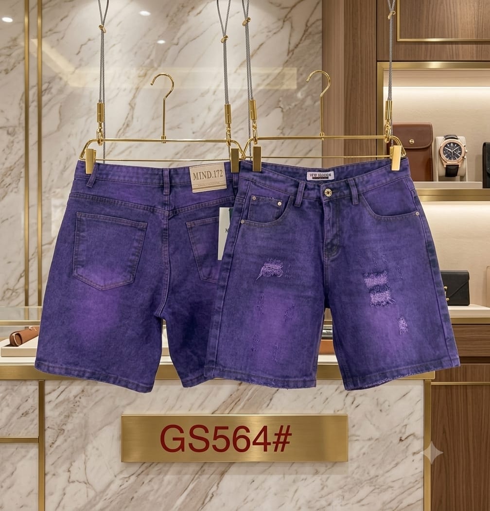 Purple denim shorts with distressed rips and patches displayed in a retail setting.