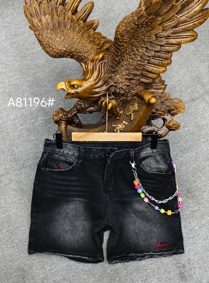 Black denim shorts with colorful beaded chain accessory displayed against an eagle statue background.