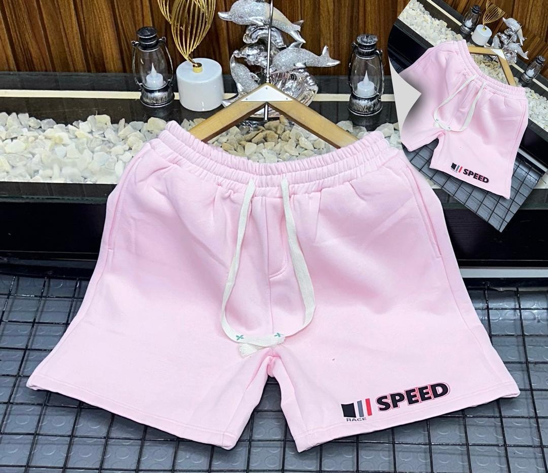 Pink fleece shorts with Speed Race graphic print on leg.