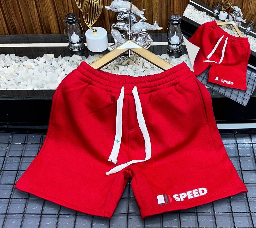 Red fleece shorts with Speed Race graphic print on leg.
