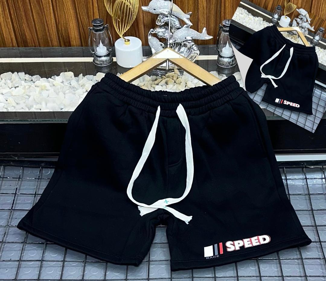 Black fleece shorts with Speed Race graphic print on leg.