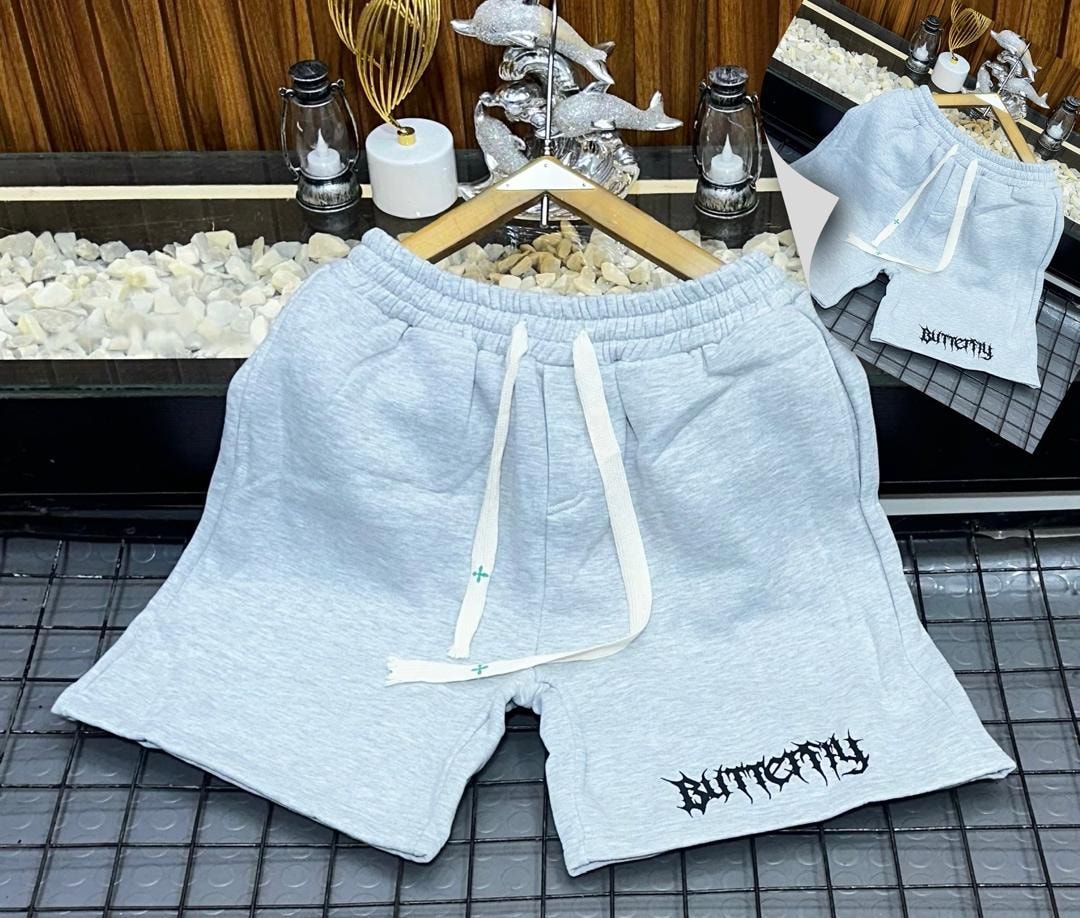 Light gray fleece shorts with black gothic Butterfly print on leg.