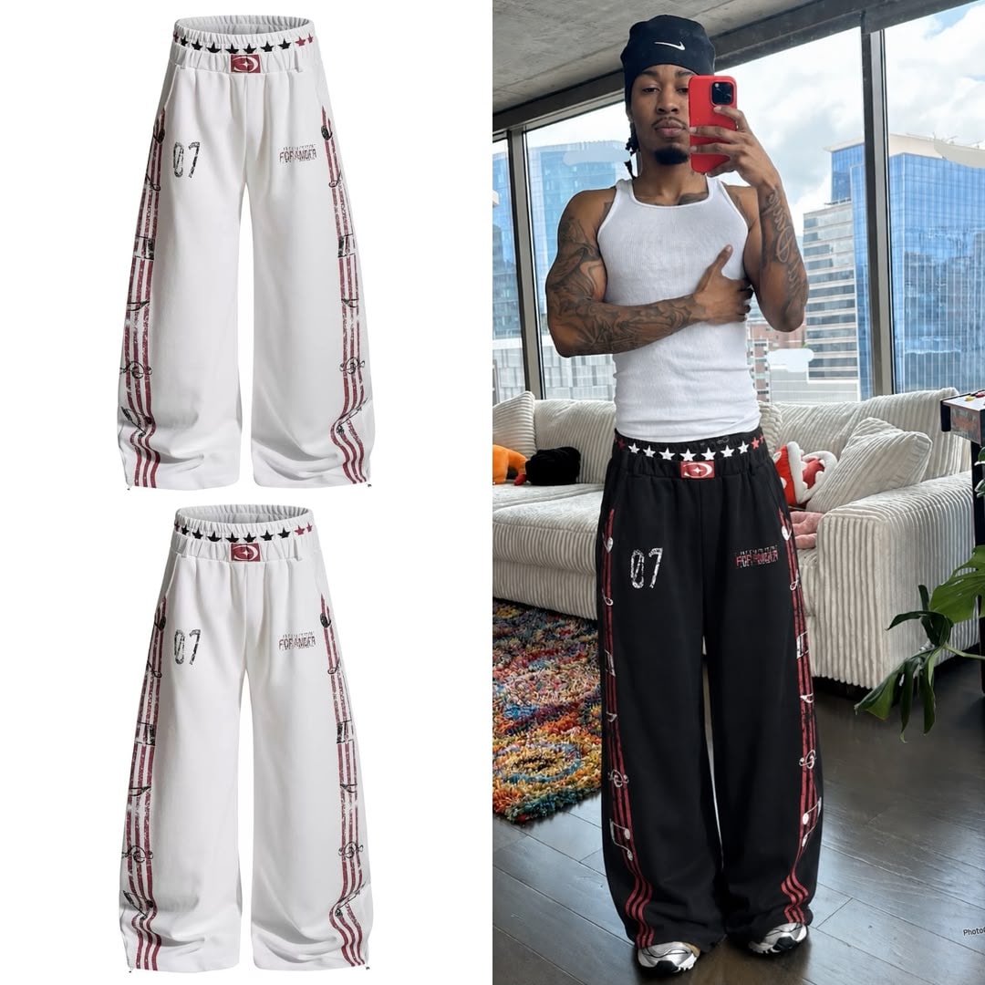 White graphic joggers in flat lay views alongside model wearing the black version.