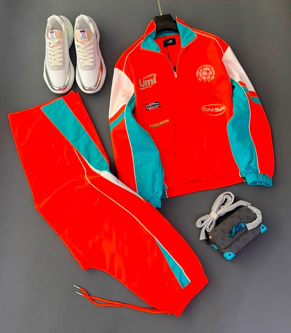 Red teal and white two-piece tracksuit with sneakers and bag.