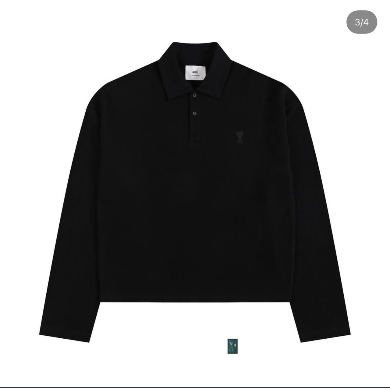 Black AMI long sleeve polo shirt on white background showing chest logo and collar.